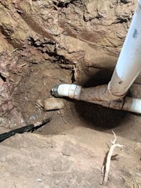 a pipe is in a hole in the ground